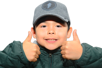 A child giving a thumbs up, indicating positivity or approval